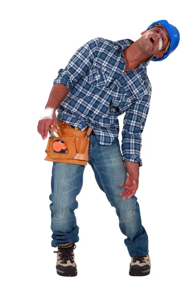 Gewonde ambachtsman bedekt met pleisters — Stockfoto