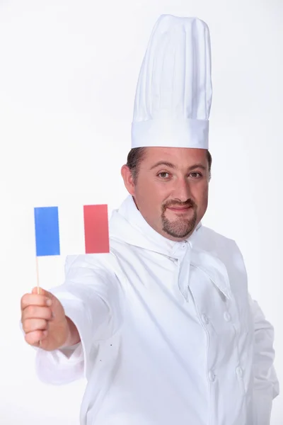 Chef-kok een Franse vlag zwaaien — Stockfoto