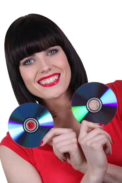 Vrouw waarin twee cd-rom — Stockfoto