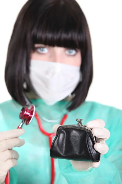 Female doctor holding wallet — Stock Photo, Image