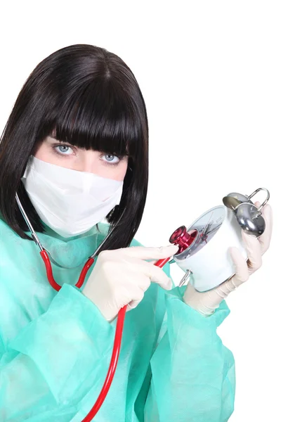 Female doctor with clock — Stock Photo, Image