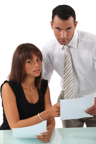 Business couple discussing paperwork — Stock Photo, Image