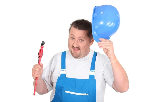 Jolly plumber with a pipe wrench — Stock Photo, Image