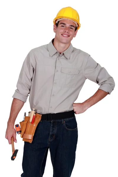 Portrait of a tradesman holding a hammer — Stock Photo, Image