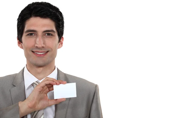 Biznesmen trzyma jego wizytówkę — Zdjęcie stockowe