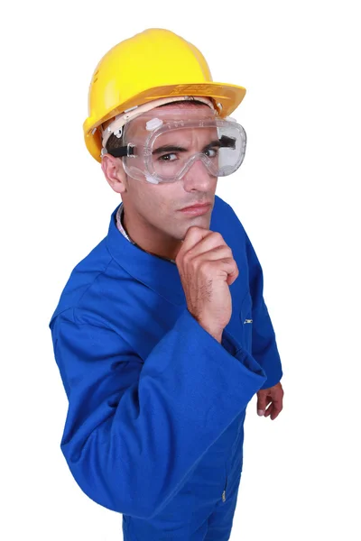 Un trabajador de la construcción dudoso . — Foto de Stock