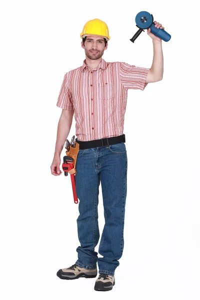 Un manitas sosteniendo una rectificadora . —  Fotos de Stock