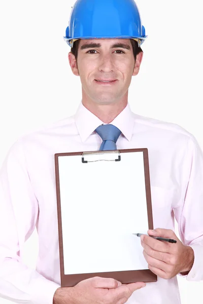 Inspector holding clip-board — Stock Photo, Image