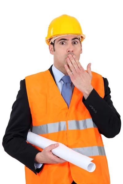 Construction businessman putting a hand on his mouth — Stock Photo, Image