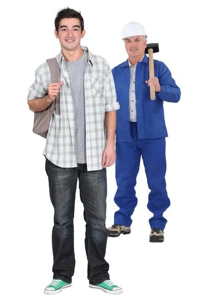 Young apprentice standing near his boss — Stock Photo, Image