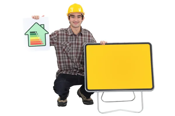 Man showing energy rating sign — Stock Photo, Image