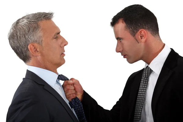 Young man fed-up with his boss Stock Photo