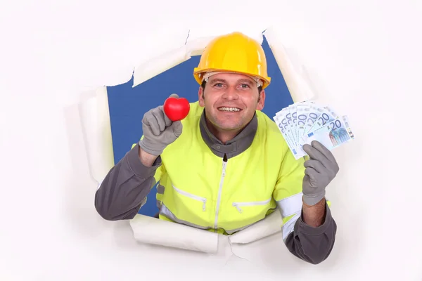 A construction worker showing his cash. — Stock Photo, Image