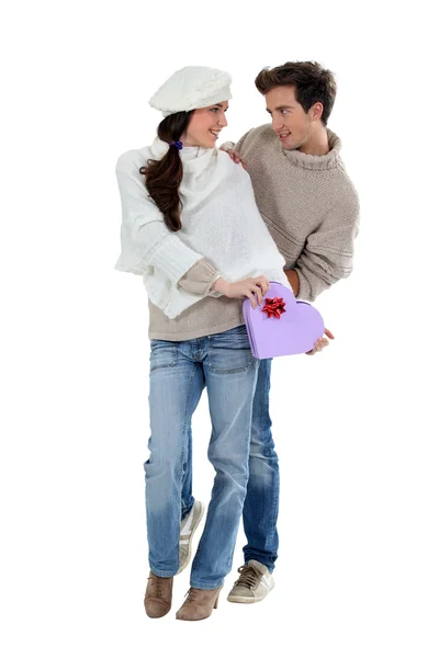 Young couple with a heart shaped box — Stock Photo, Image