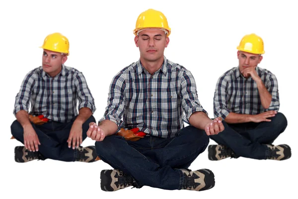 Constructor en posición sentada yoga — Foto de Stock