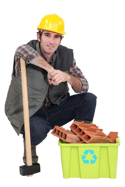 Worker with box full of debris — Stock Photo, Image