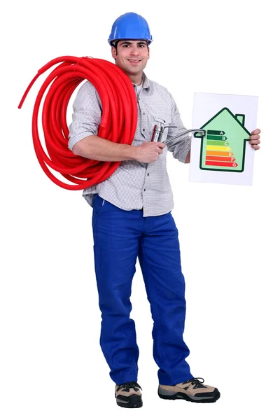 A plumber holding a diagram. — Stock Photo, Image