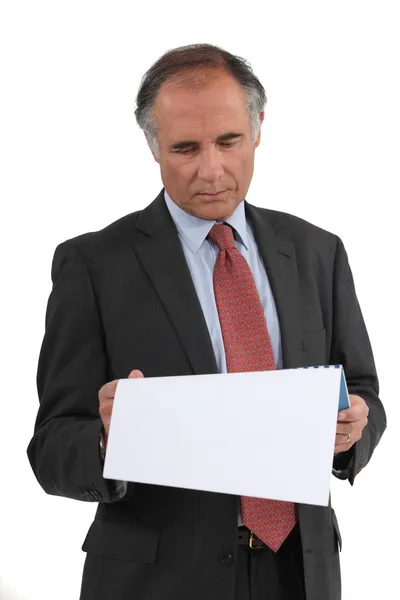 Businessman reading a document — Stock Photo, Image
