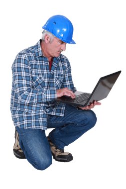 Construction foreman embracing technology clipart
