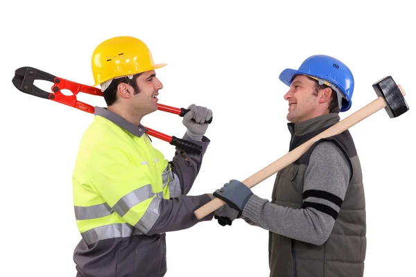 Trabajadores de la construcción estrechando manos — Foto de Stock