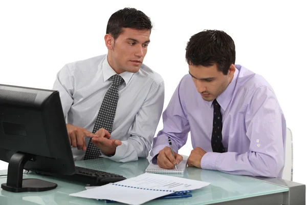 Two businessmen working on project Stock Photo