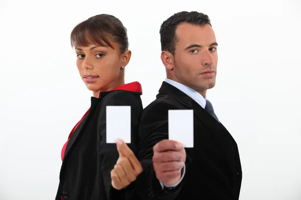 Businessman and woman holding calling cards — Stock Photo, Image