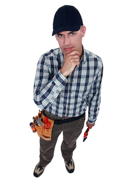 A perplexed handyman — Stock Photo, Image