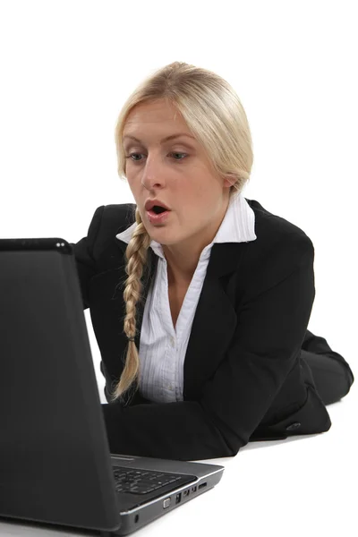 Woman surprised in front of laptop Royalty Free Stock Images