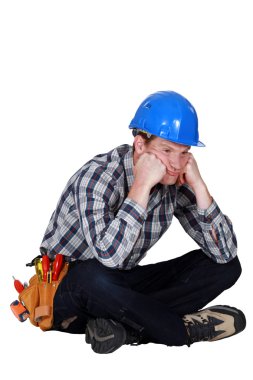 A fed-up and bored tradesman clipart