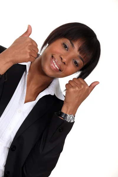 Businesswoman giving two thumbs-up to idea — Stock Photo, Image