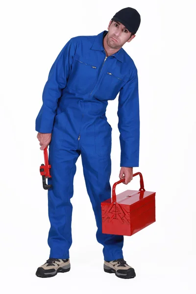 Plumber holding toolbox — Stock Photo, Image