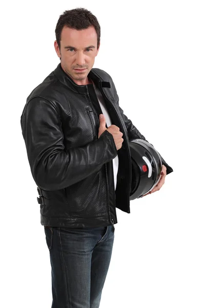 Biker holding jacket — Stock Photo, Image