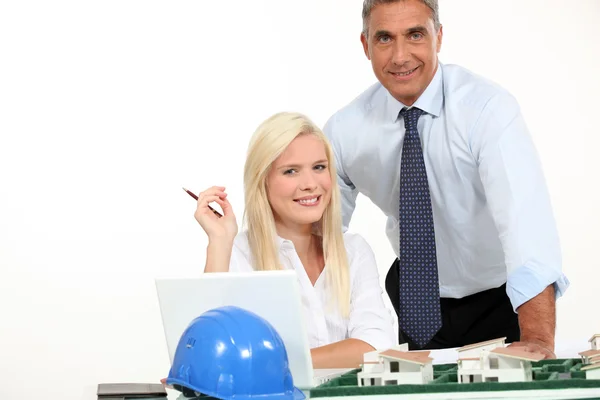 Architects stood by model housing — Stock Photo, Image