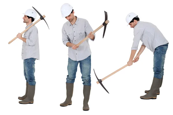 Woker holding pick axe — Stock Photo, Image