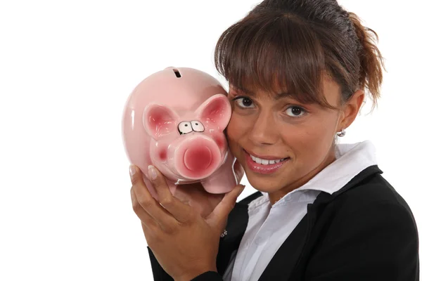 Mulher com um banco porquinho na mão — Fotografia de Stock