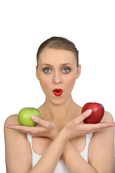 Pretty woman with apples in hands — Stock Photo, Image