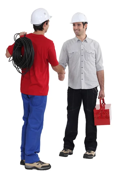 Two electricians greeting each other — Stock Photo, Image