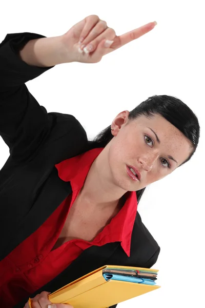 Vrouw houdt haar wijsvinger omhoog — Stockfoto