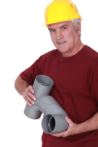 A plumber holding parts — Stock Photo, Image