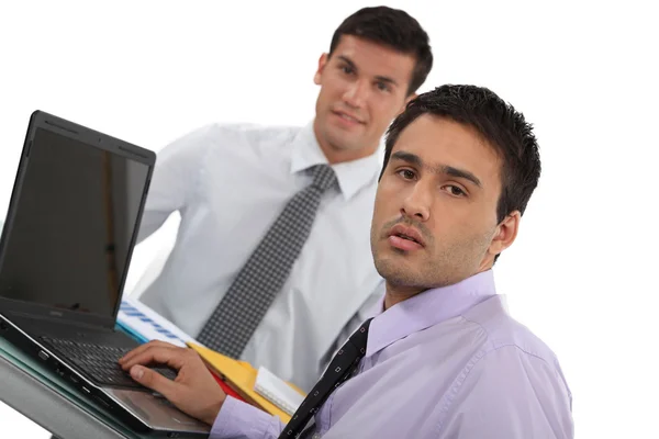 Young executives with a laptop Royalty Free Stock Images