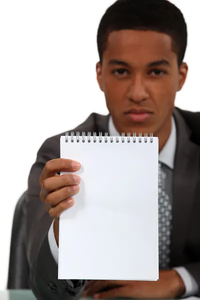 Businessman holding blank note pad — Stock Photo, Image