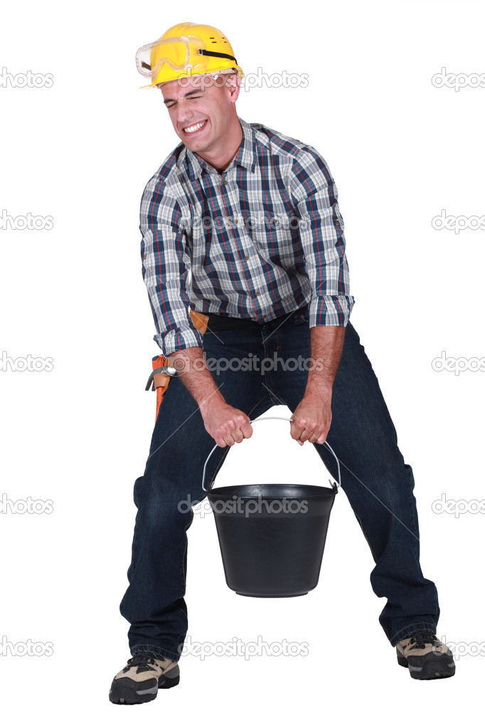 Craftsman carrying a very heavy bucket Stock Photo by ©photography33