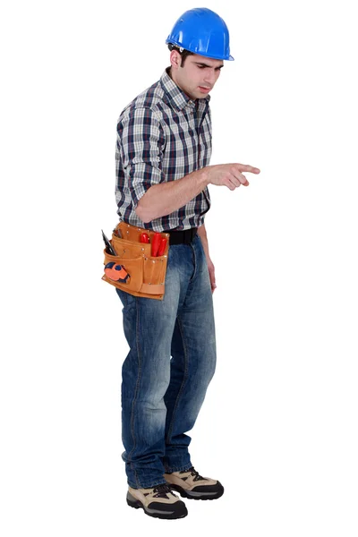 Craftsman pointing at something — Stock Photo, Image