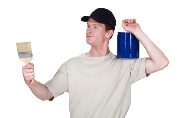 Painter examining new brush — Stock Photo, Image