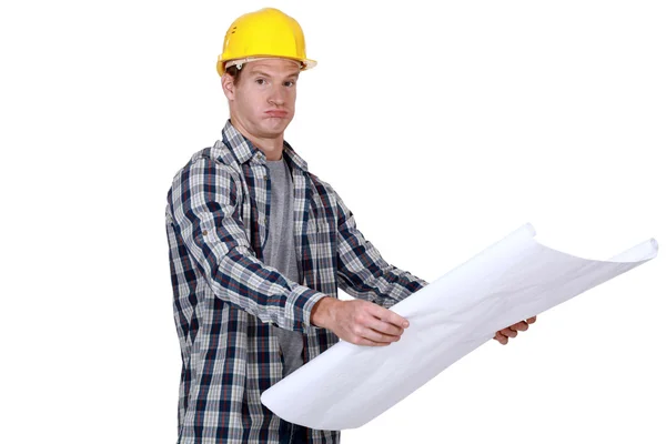 A foreman checking his plans. — Stock Photo, Image