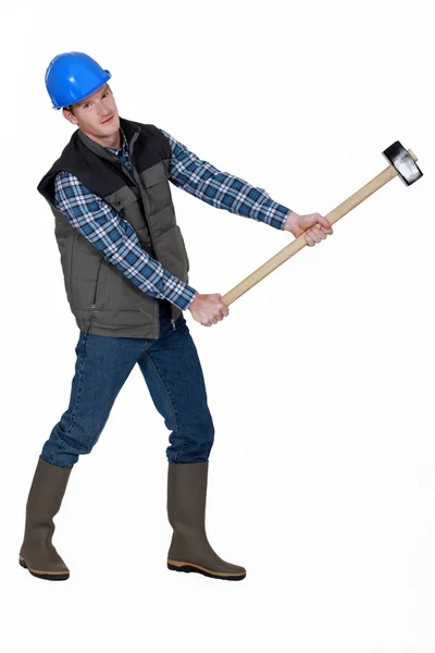 Craftsman holding a huge hammer — Stock Photo, Image