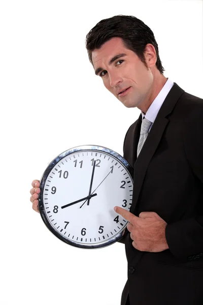 Man pointing to clock — Stock Photo, Image