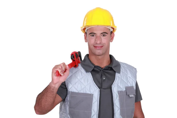 Man resting wrench on shoulder — Stock Photo, Image