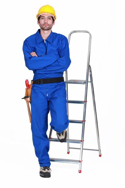 Portrait of a standoffish tradesman with his arms crossed — Stock Photo, Image