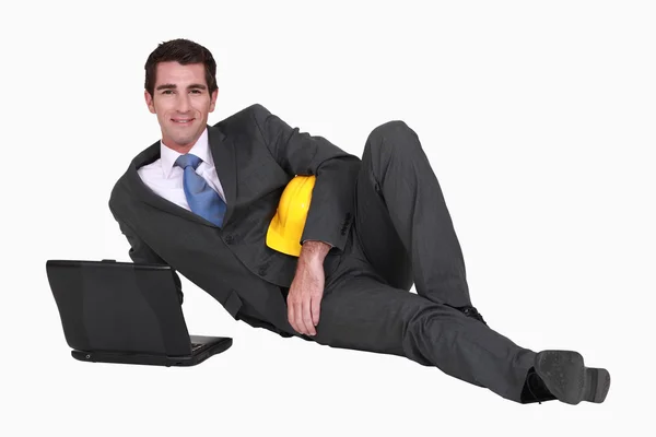 Architect laying on floor with laptop — Stock Photo, Image